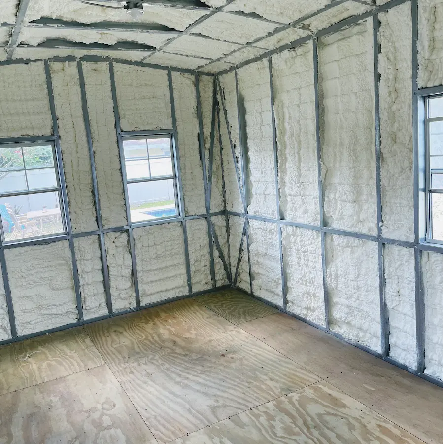 Closed-cell spray foam insulation applied to wall cavities in a residential project in Tomball